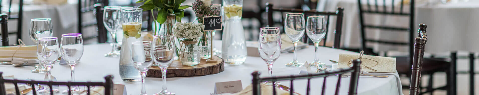 Wedding Table Set Up Decoration With Flowers And Glasses